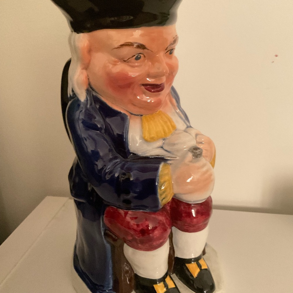 Captain (Toby Ware) sitting with a jug of whiskey 9.5” pitcher (England)